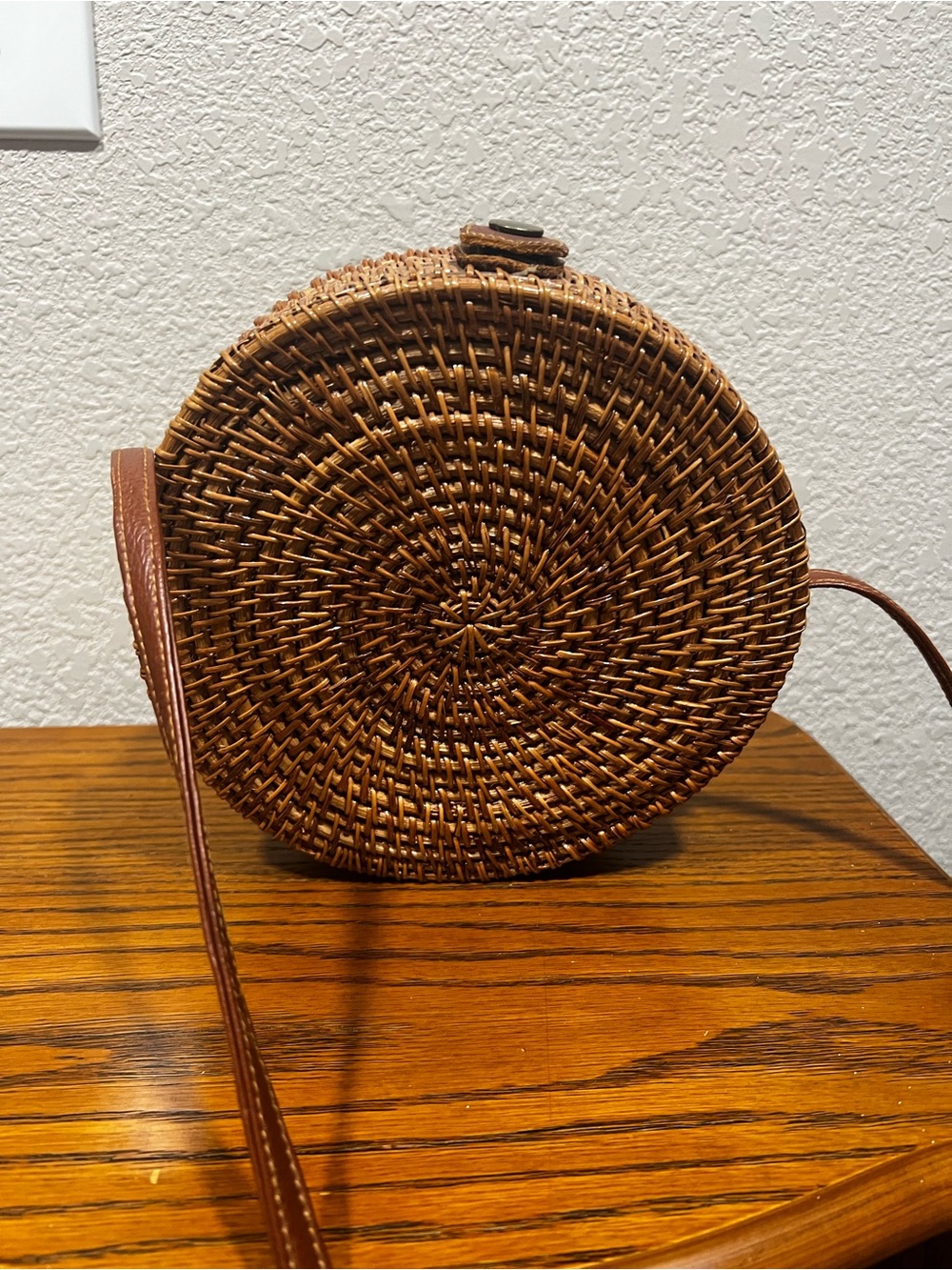 Round Woven Crossbody Bag in Brown